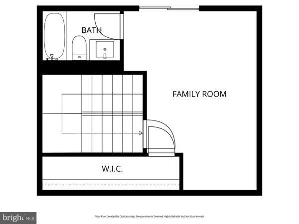 a picture of a bench in front of a wall