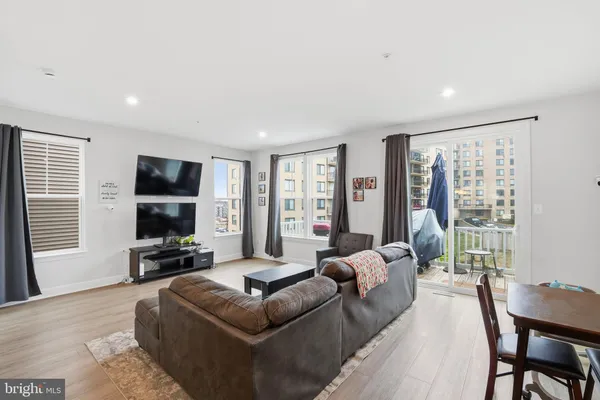 a living room with furniture fireplace and a flat screen tv