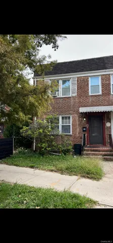 a view of house with backyard and garden