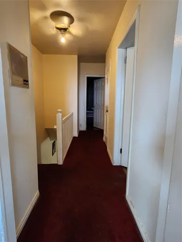 a view of a hallway with a white walls