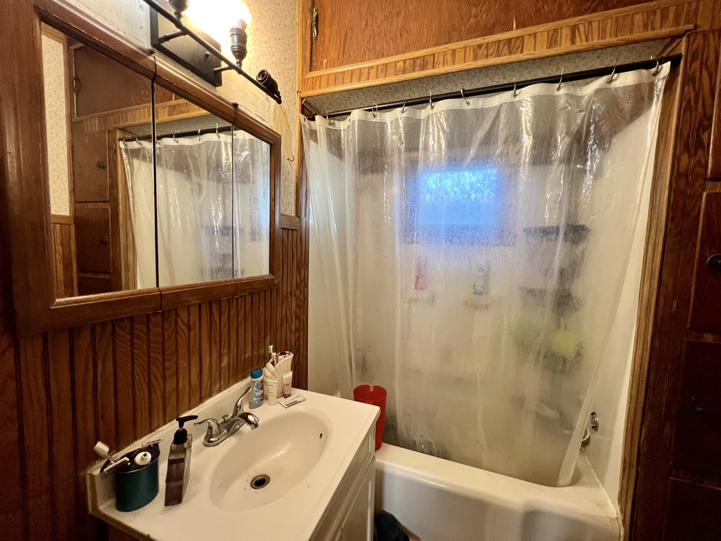 514 West Harrison Street Villa Grove, IL 61956 - Photo 19 of 21 a bathroom with a sink and a mirror