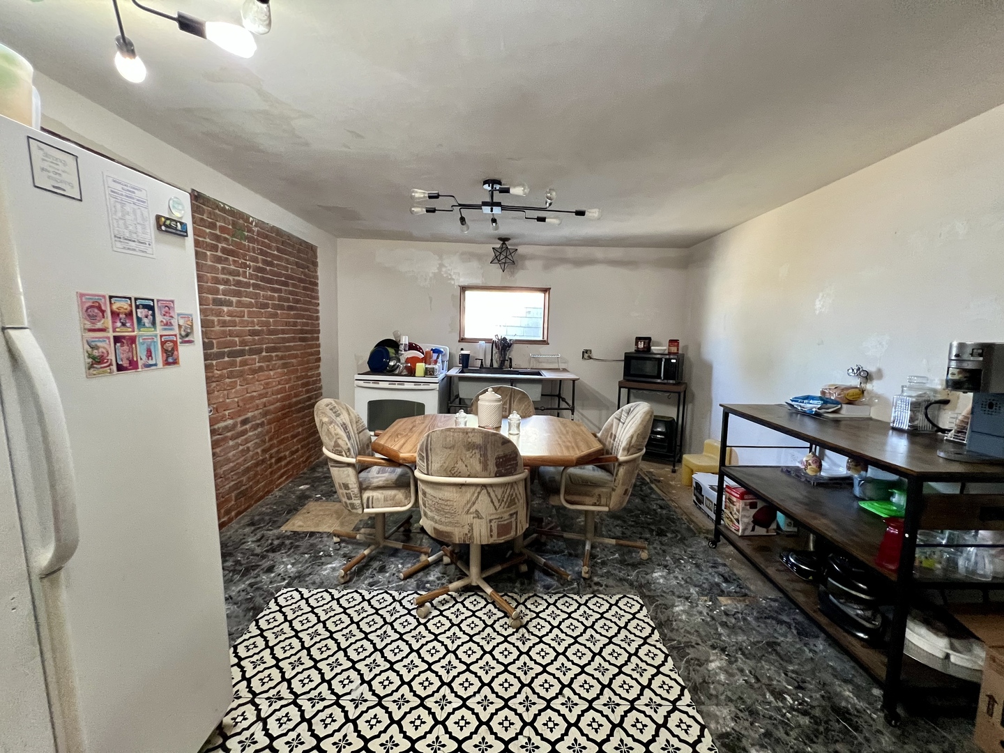 514 West Harrison Street Villa Grove, IL 61956 - Photo 7 of 21 a living room with a couch and a table with wooden floor
