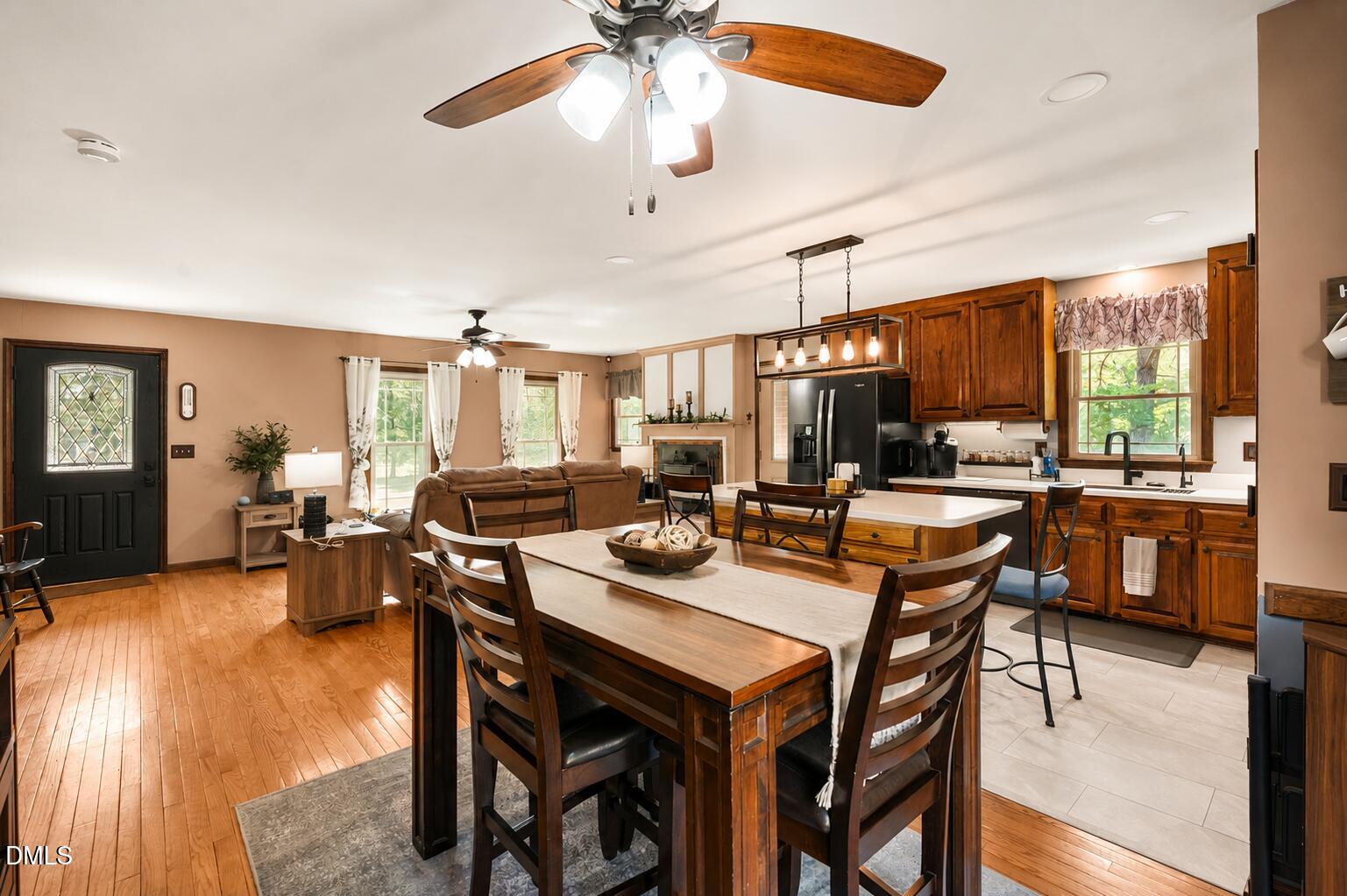 4209 Lassiter Road Wake Forest, NC 27587 - Photo 25 of 39 a view of a dining room with furniture window and wooden floor