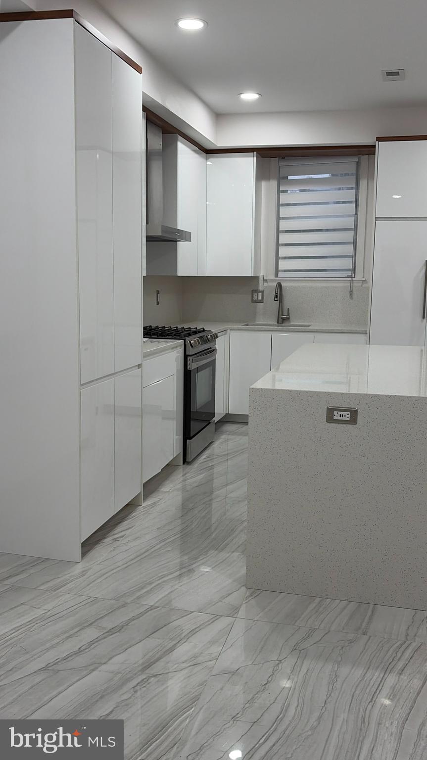 726 Roxboro Place Northwest Washington, DC 20011 - Photo 5 of 21 a kitchen with stainless steel appliances granite countertop a sink and cabinets