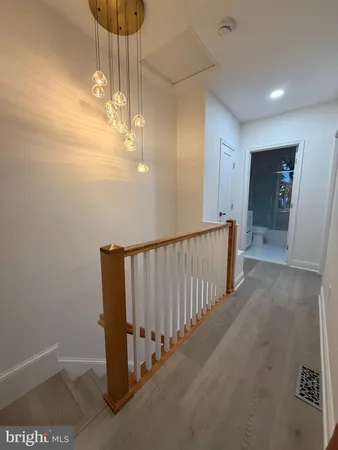 a view of a hallway with a chandelier