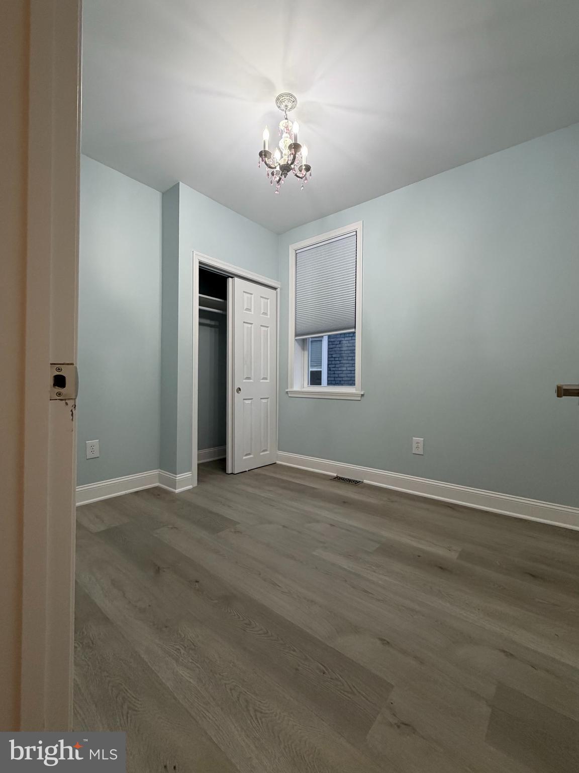 726 Roxboro Place Northwest Washington, DC 20011 - Photo 10 of 21 an empty room with wooden floor and windows