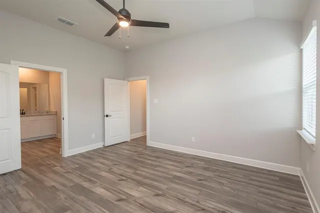 a kitchen with a stove a sink and a refrigerator