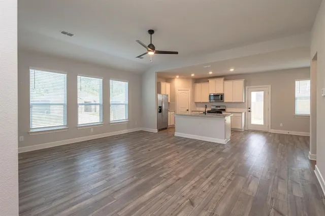 a view of a yard in front of a house with a yard
