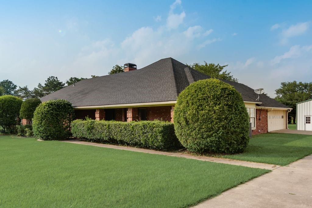 1959 Meadow Way Terrell, TX 75160 - Photo 1 of 1 front view of a house with a garden