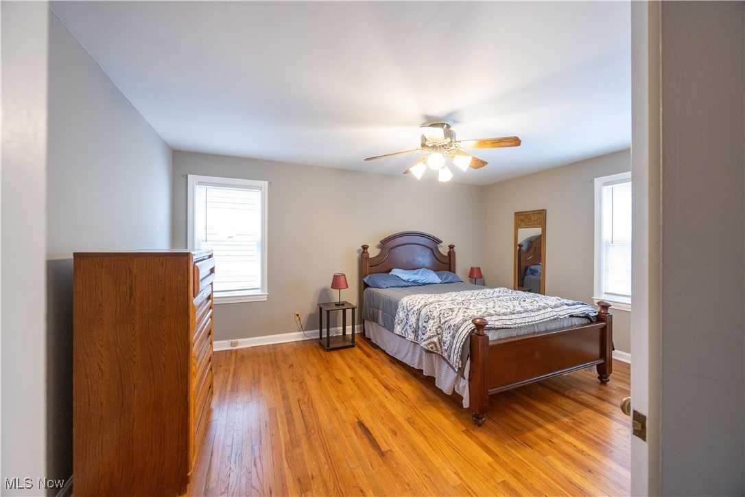 1937 Staunton Road Cleveland, OH 44118 - Photo 15 of 31 Bedroom with light wood-type flooring, a ceiling fan, and multiple windows