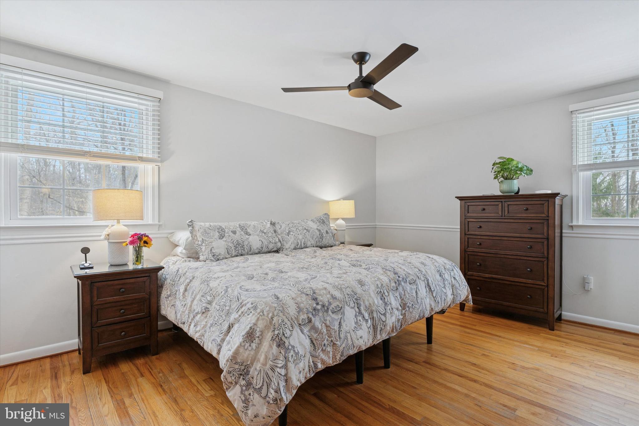 1052 West Valley Hill Road Malvern, PA 19355 - Photo 14 of 25 a bedroom with a bed and wooden floor