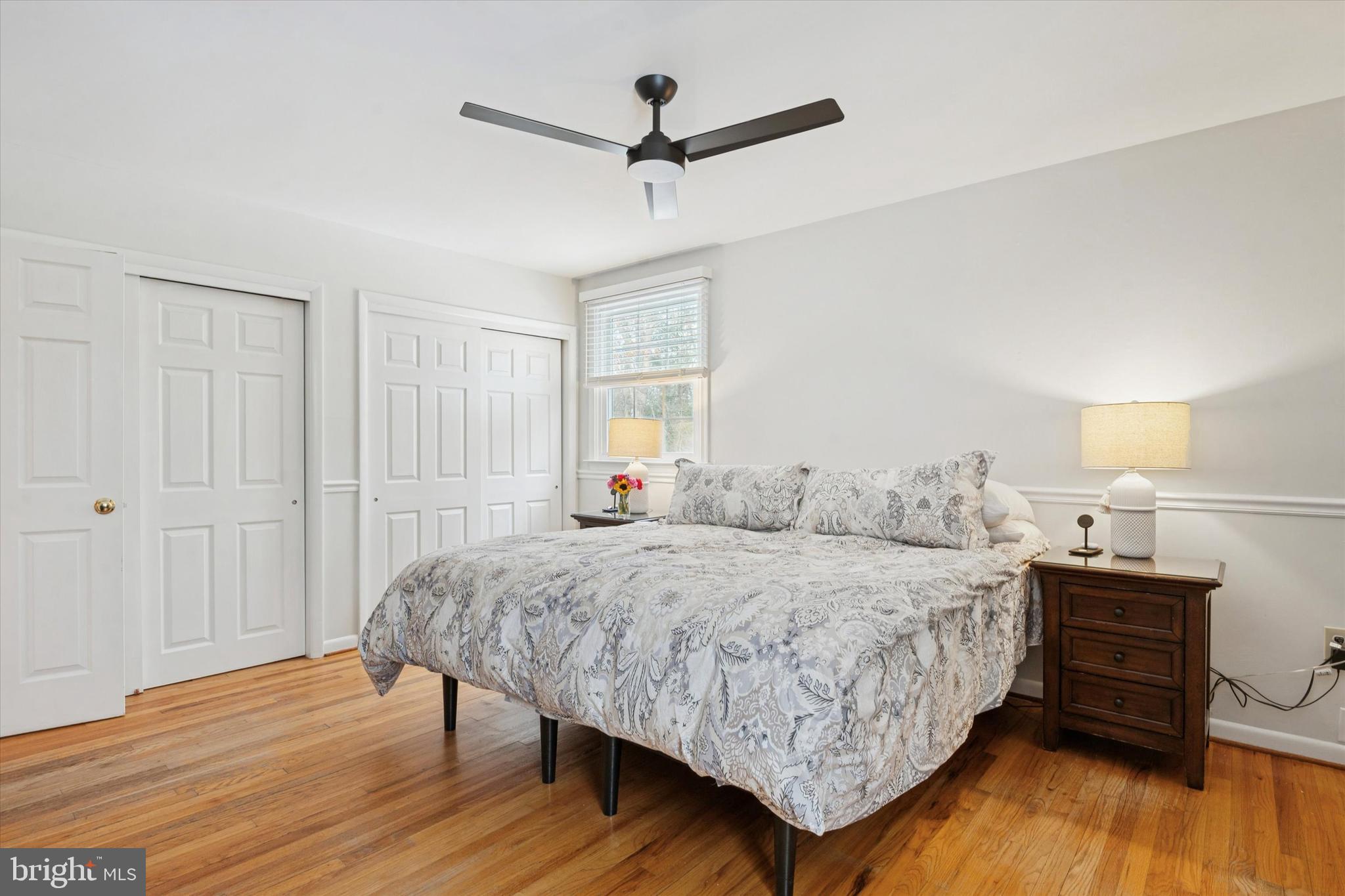 1052 West Valley Hill Road Malvern, PA 19355 - Photo 15 of 25 a bedroom with a bed and a table