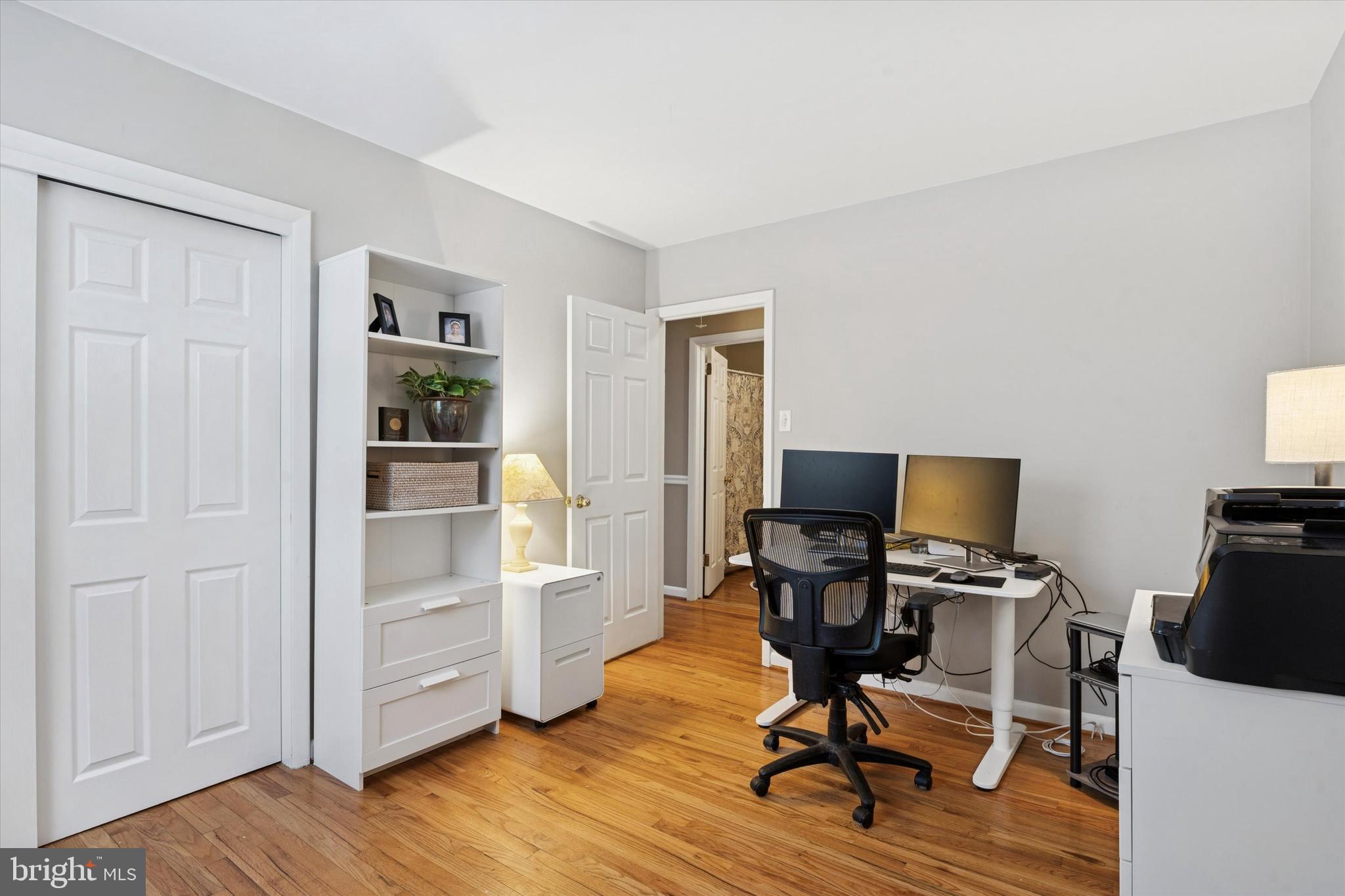1052 West Valley Hill Road Malvern, PA 19355 - Photo 20 of 25 a view of a workspace with furniture and wooden floor