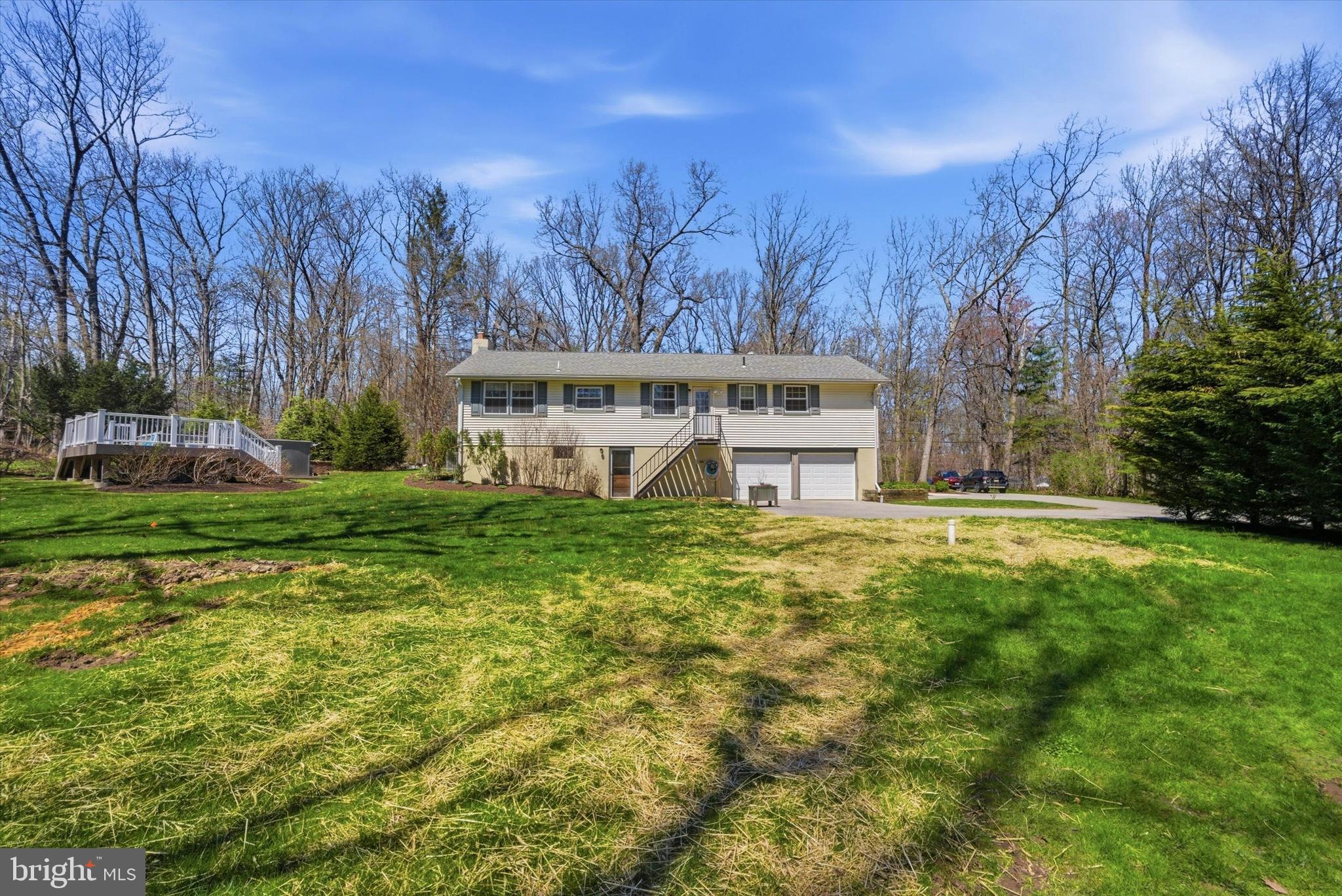 1052 West Valley Hill Road Malvern, PA 19355 - Photo 2 of 25 a view of a house with a yard table and chairs