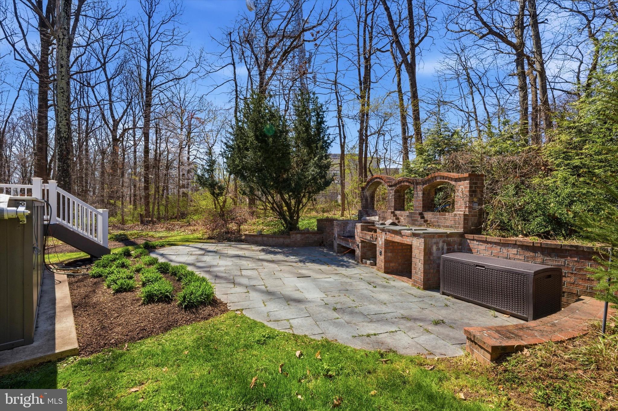 1052 West Valley Hill Road Malvern, PA 19355 - Photo 4 of 25 a view of a backyard with couches under an umbrella