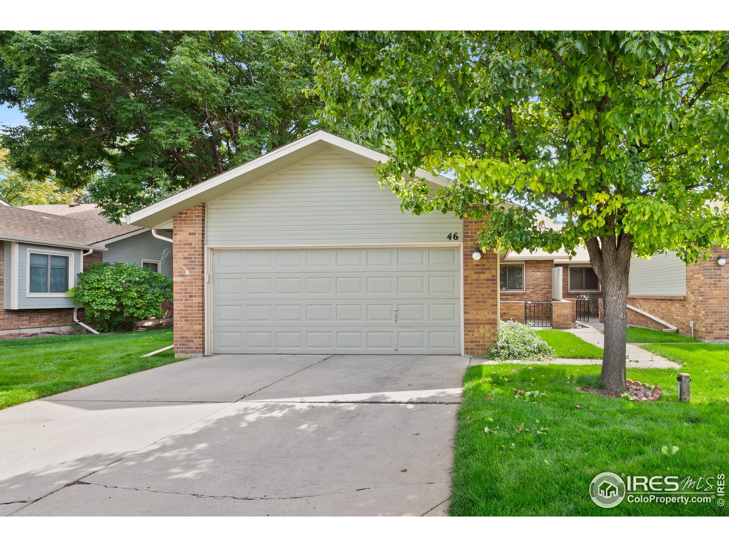 1100 South Taft Avenue, Unit 46 Loveland, CO 80537 - Photo 1 of 31 a view of backyard of house with green space