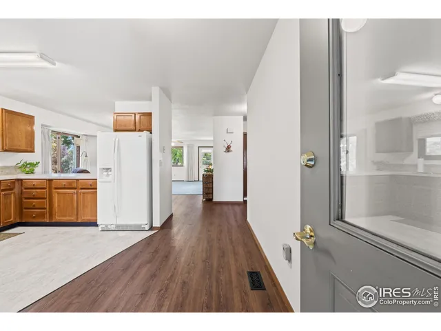 a view of a ceiling fan and hardwood floor