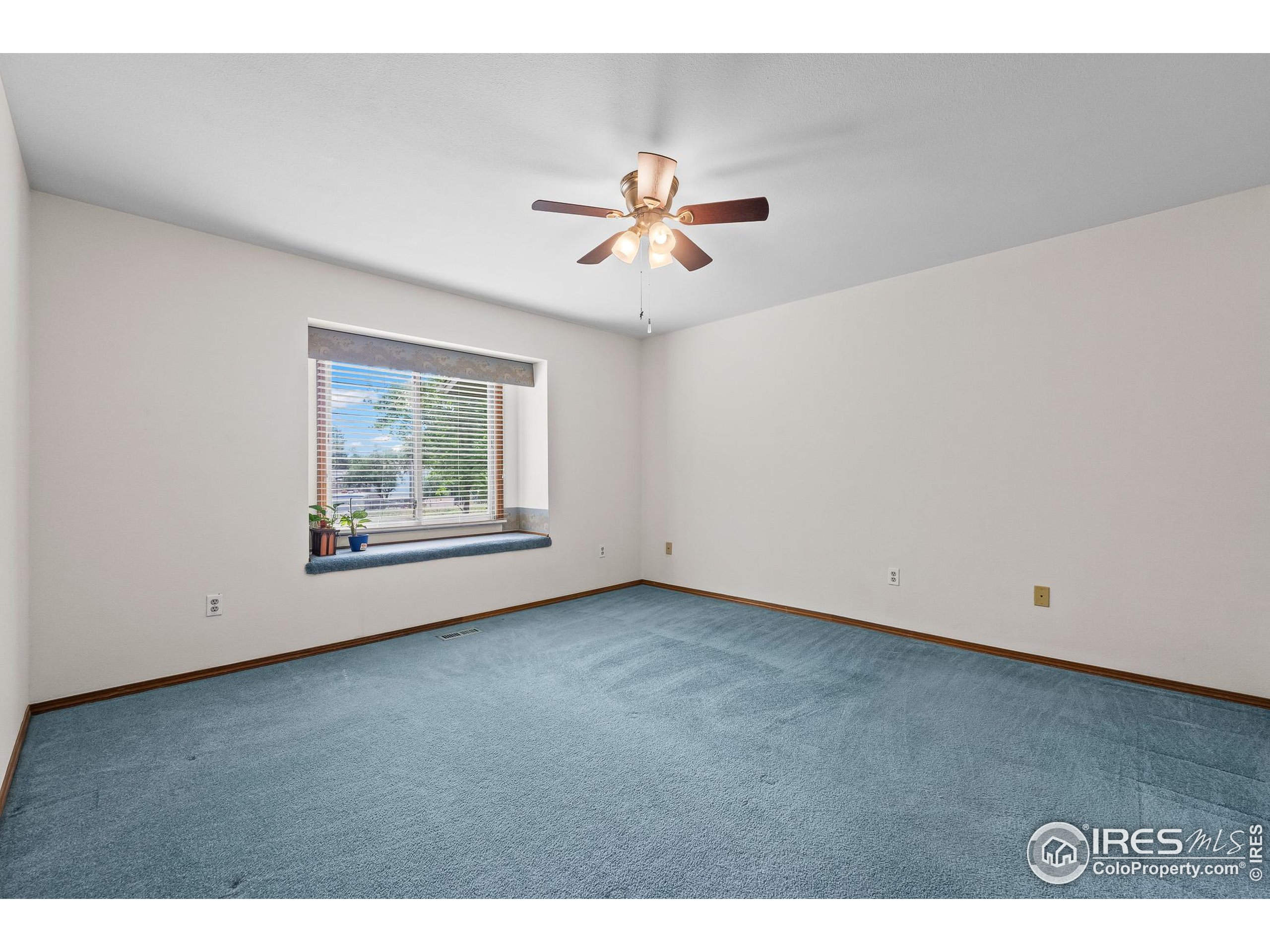 1100 South Taft Avenue, Unit 46 Loveland, CO 80537 - Photo 13 of 31 a view of a ceiling fan and hardwood floor