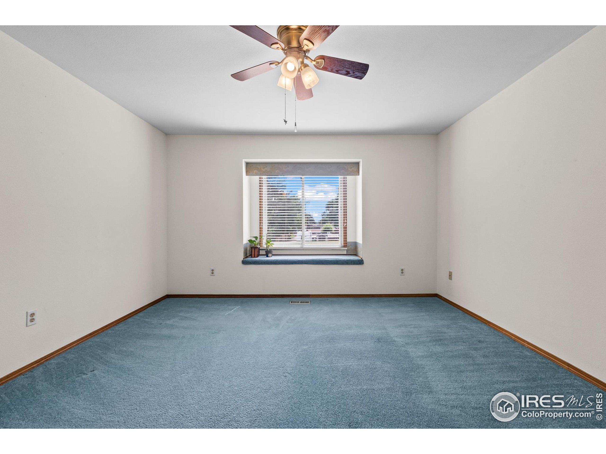 1100 South Taft Avenue, Unit 46 Loveland, CO 80537 - Photo 15 of 31 a view of an empty room with a window