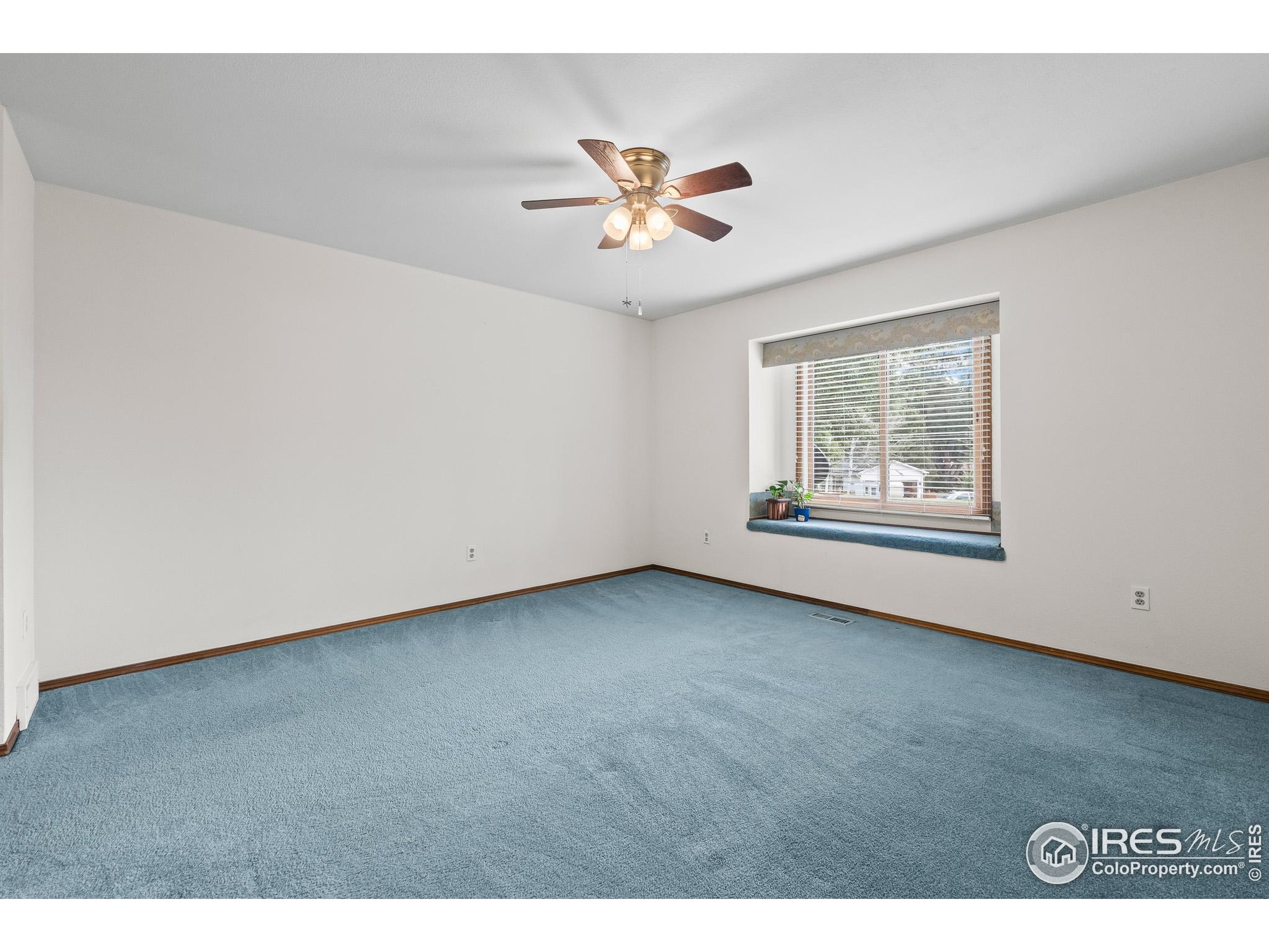 1100 South Taft Avenue, Unit 46 Loveland, CO 80537 - Photo 16 of 31 a view of an empty room with a window