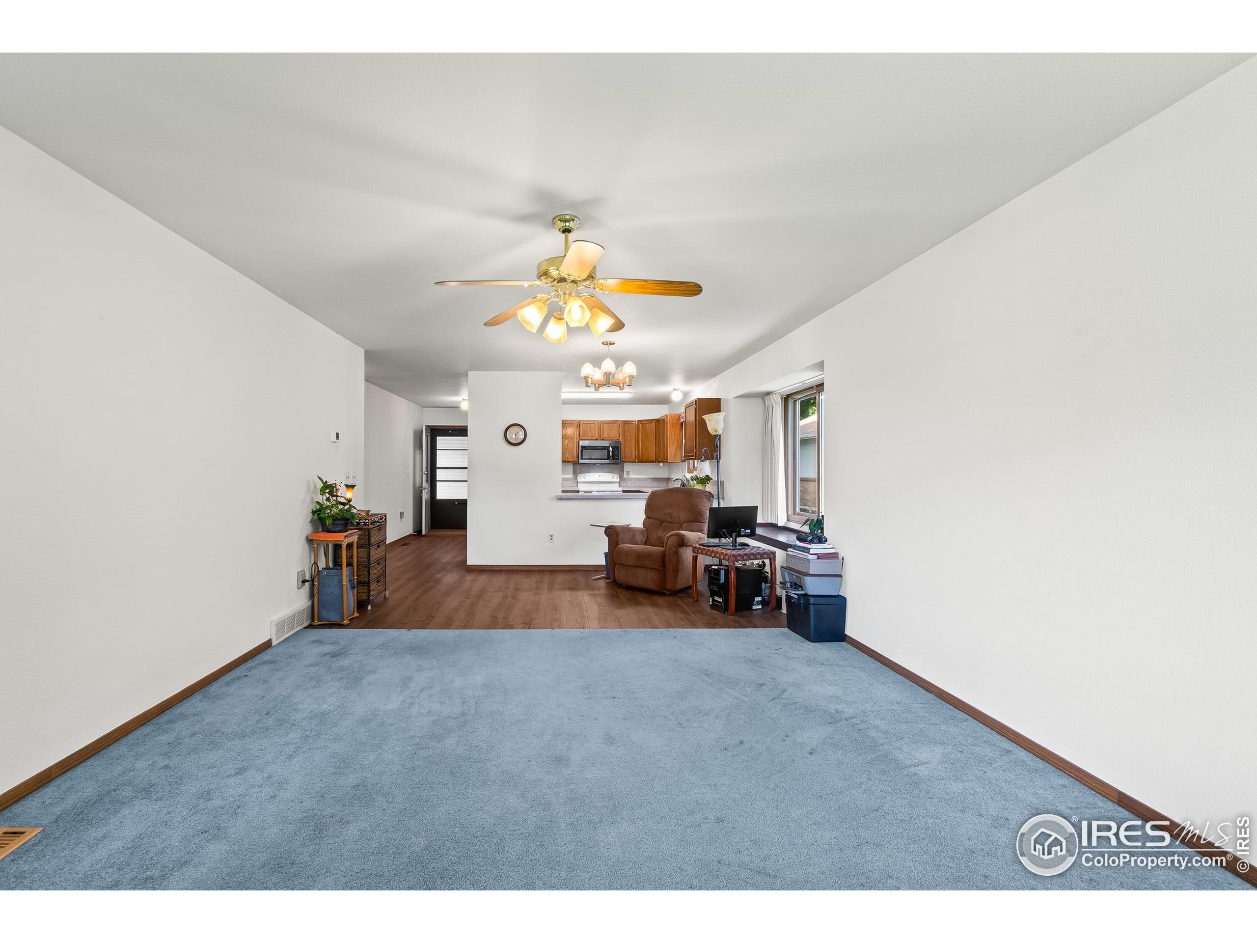 1100 South Taft Avenue, Unit 46 Loveland, CO 80537 - Photo 8 of 31 a view of livingroom with furniture and a ceiling fan