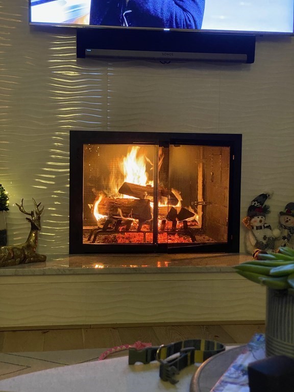 2 West Knoll Road Andover, MA 01810 - Photo 14 of 29 a view of a fireplace with two room
