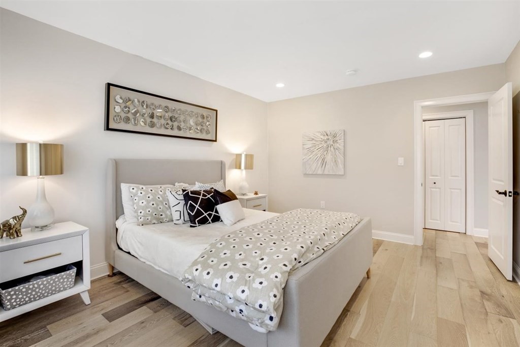 2 West Knoll Road Andover, MA 01810 - Photo 24 of 29 a bedroom with a bed and a lamp