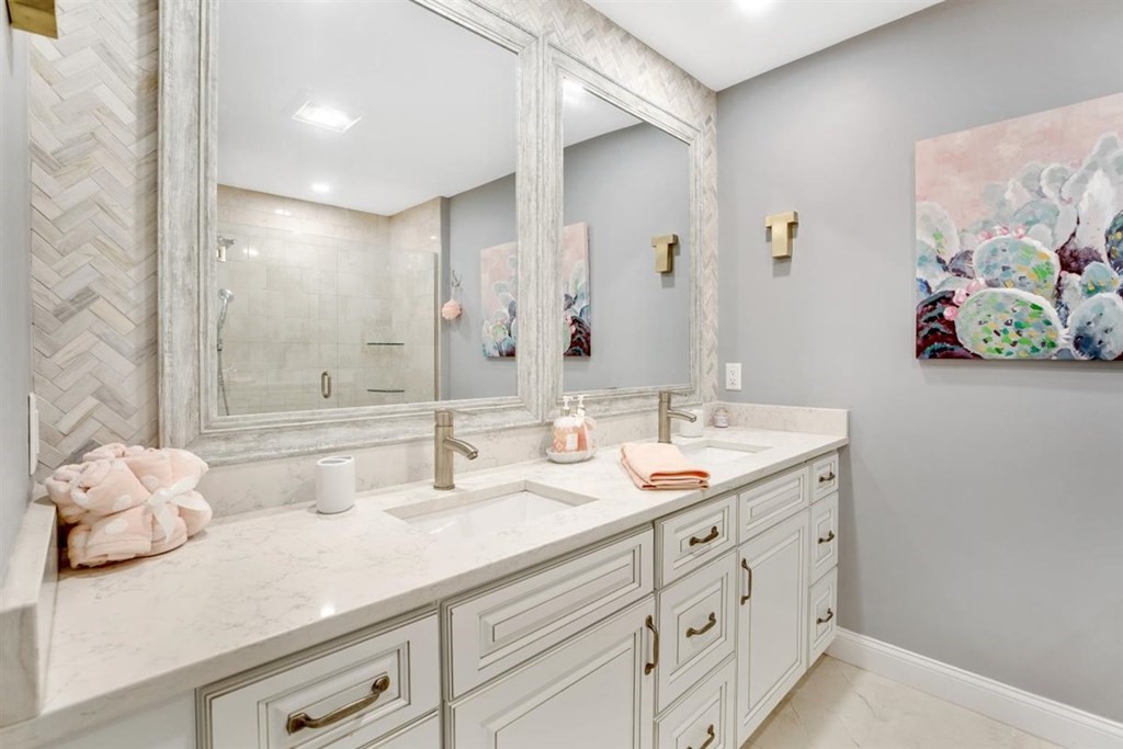 2 West Knoll Road Andover, MA 01810 - Photo 27 of 29 a bathroom with a double vanity sink and a mirror