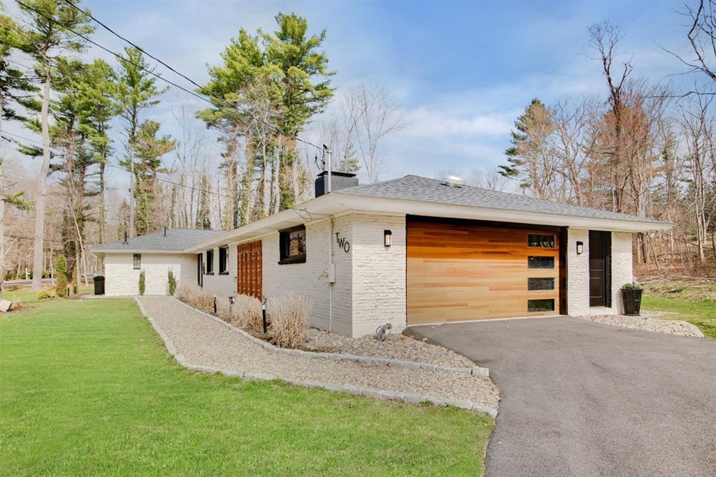 2 West Knoll Road Andover, MA 01810 - Photo 29 of 29 a front view of a house with a yard and garage