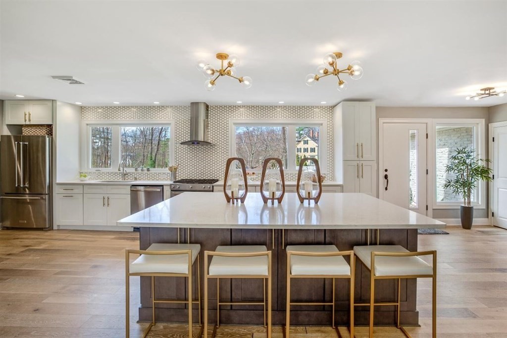 2 West Knoll Road Andover, MA 01810 - Photo 4 of 29 a view of a dining room with furniture and wooden floor