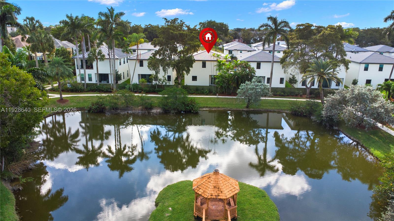1419 Southwest 23rd Street Fort Lauderdale, FL 33315 - Photo 3 of 17 a view of a lake with a building in the background