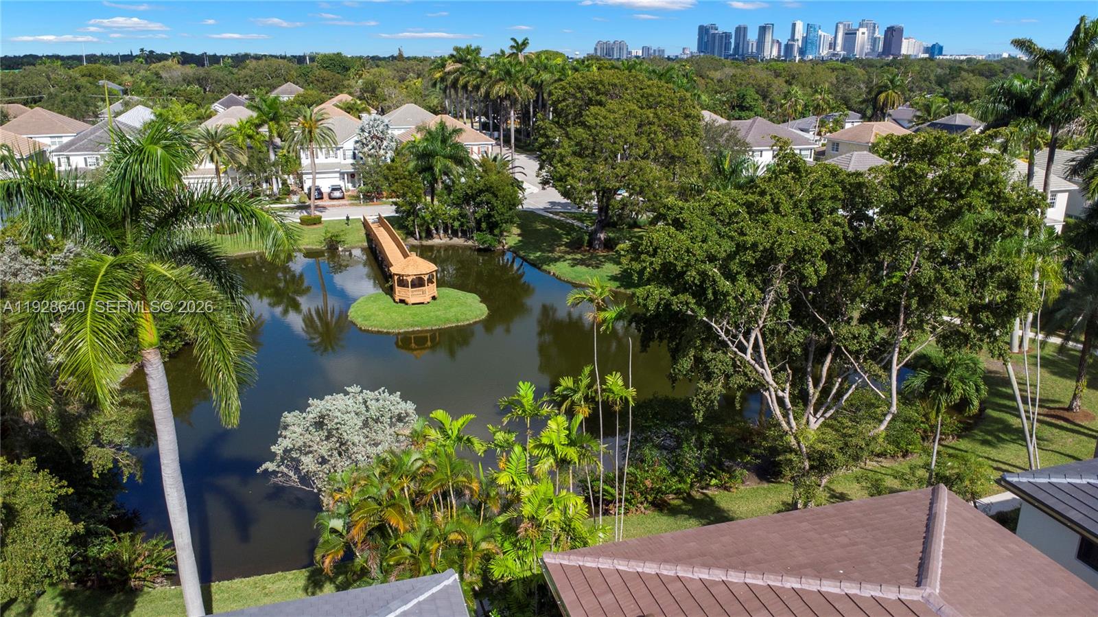 1419 Southwest 23rd Street Fort Lauderdale, FL 33315 - Photo 6 of 17 a view of a lake with a house in the background