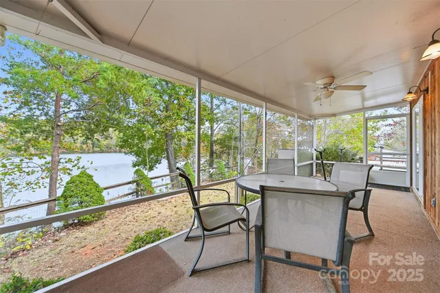 a dining room with furniture window and outside view