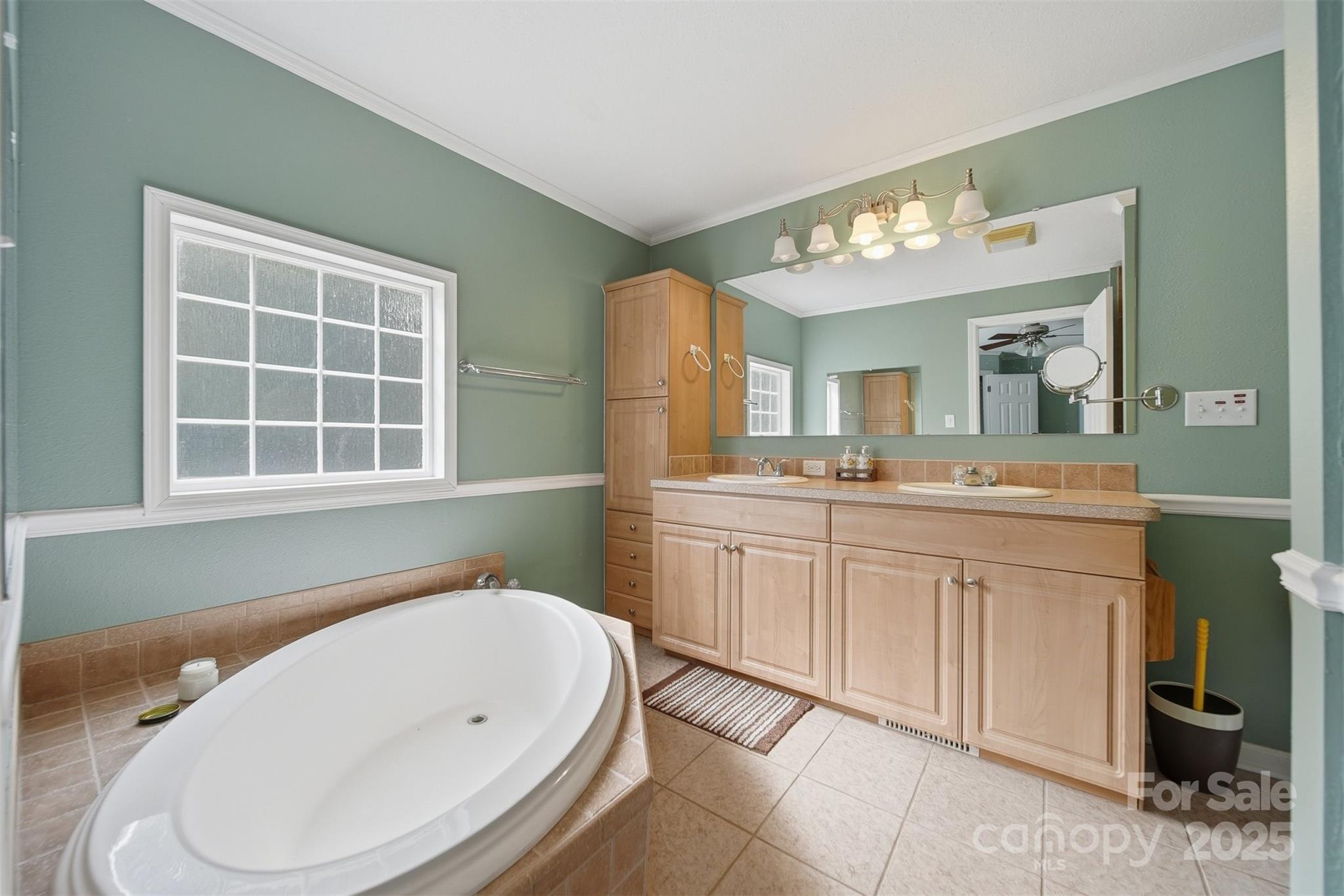 4247 Laurel Hill Road Claremont, NC 28610 - Photo 16 of 34 a bathroom with a sink a toilet and mirror