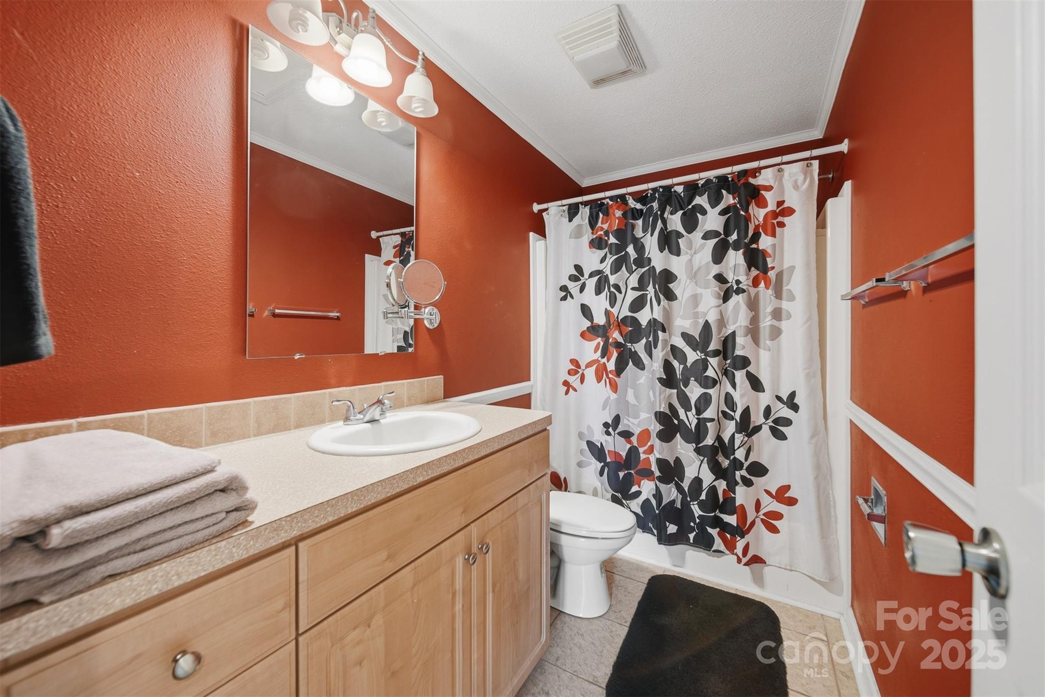 4247 Laurel Hill Road Claremont, NC 28610 - Photo 19 of 34 a bathroom with a sink toilet and shower