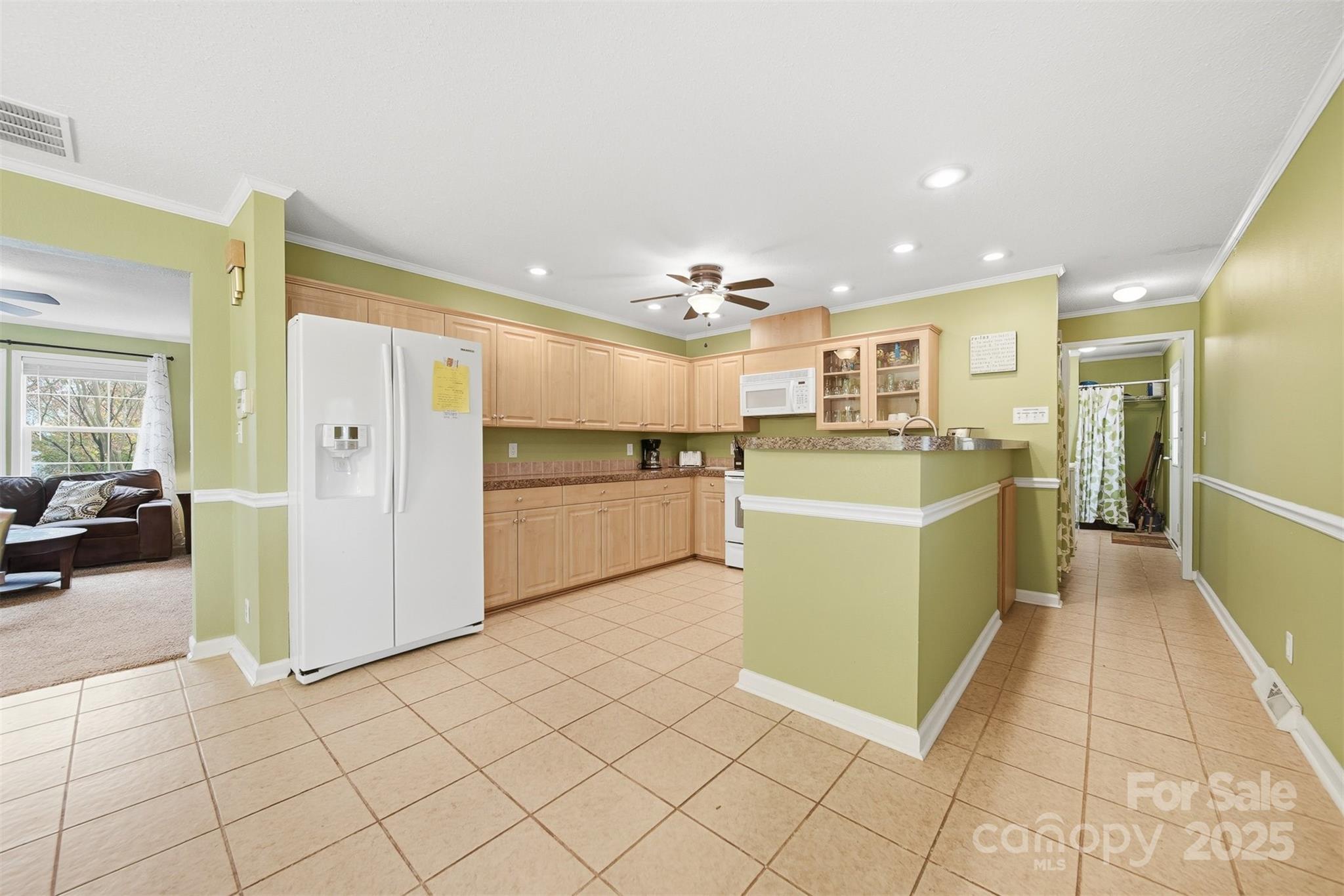 4247 Laurel Hill Road Claremont, NC 28610 - Photo 8 of 34 a view of a kitchen with furniture and refrigerator