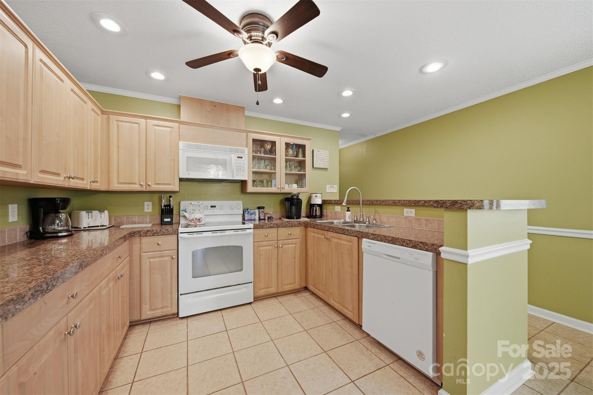 4247 Laurel Hill Road Claremont, NC 28610 - Photo 9 of 34 a kitchen with stainless steel appliances granite countertop a sink and cabinets