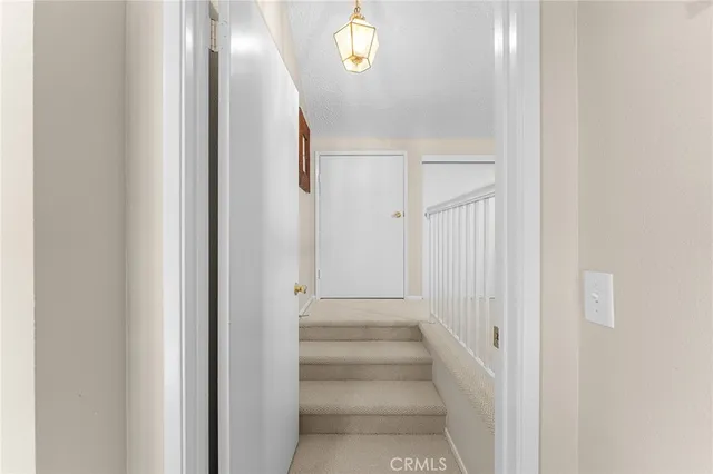 a view of entryway with stairs