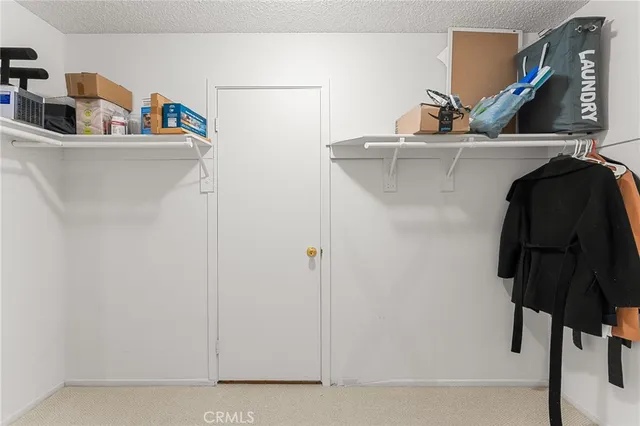 a kitchen with a sink and a refrigerator