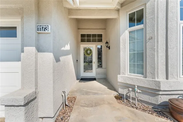a living room with a couch and a window