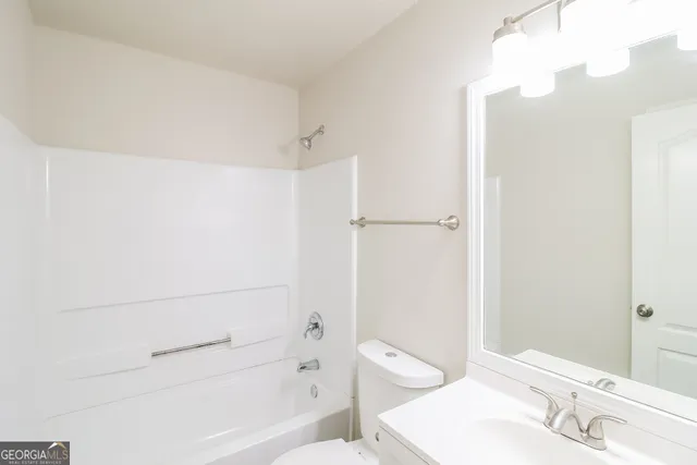 a bathroom with a sink and toilet