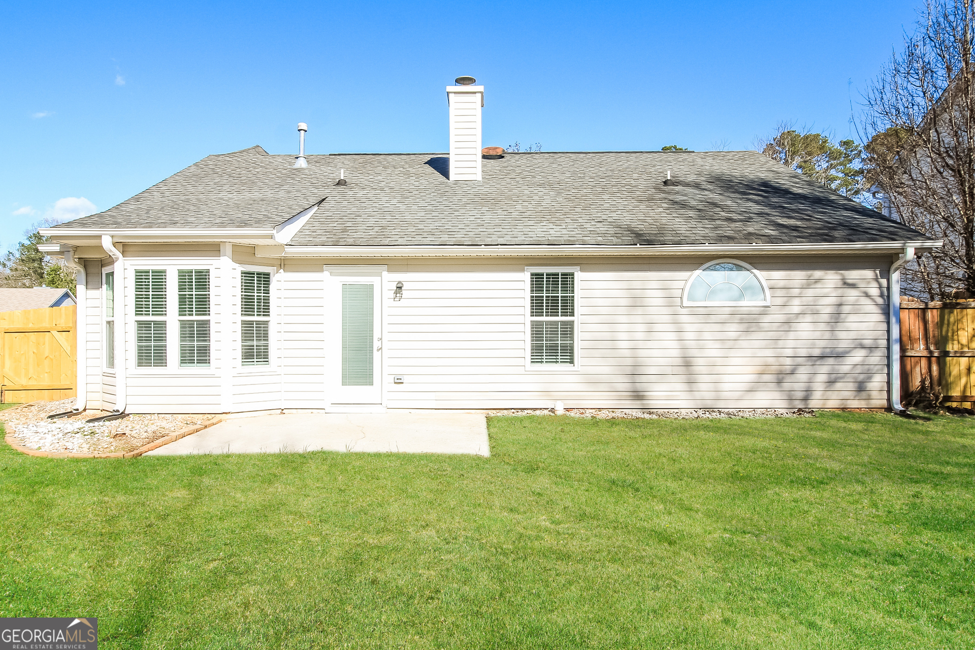 10381 Commons Crossing Jonesboro, GA 30238 - Photo 14 of 17 a front view of a house with a yard