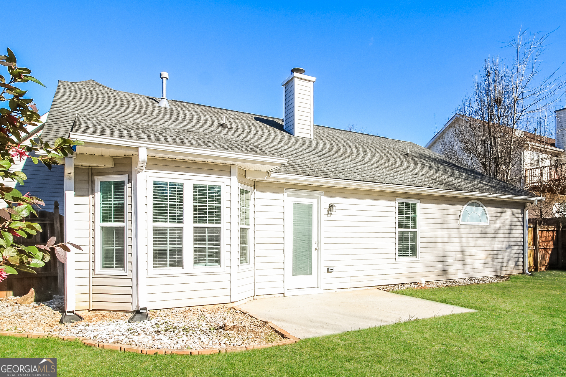 10381 Commons Crossing Jonesboro, GA 30238 - Photo 15 of 17 a front view of a house with a yard