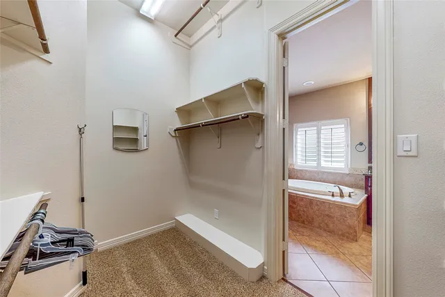 a bathroom with a tub and shower