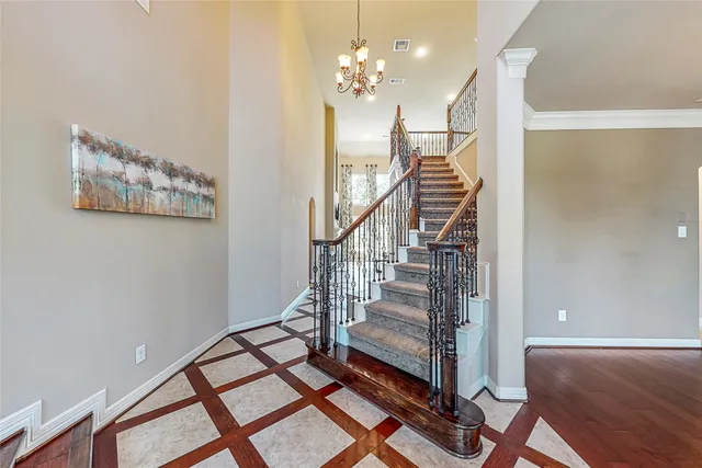 a view of entryway and hall with wooden floor
