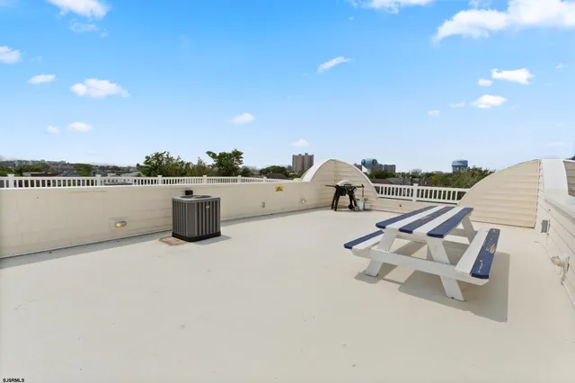 a view of staircase with white walls