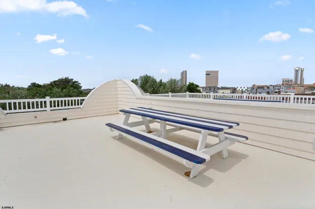 a bedroom with furniture and a book shelf