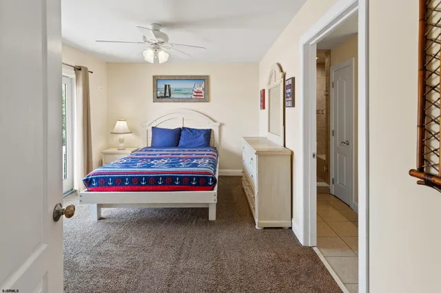 a bathroom with a granite countertop shower and a sink