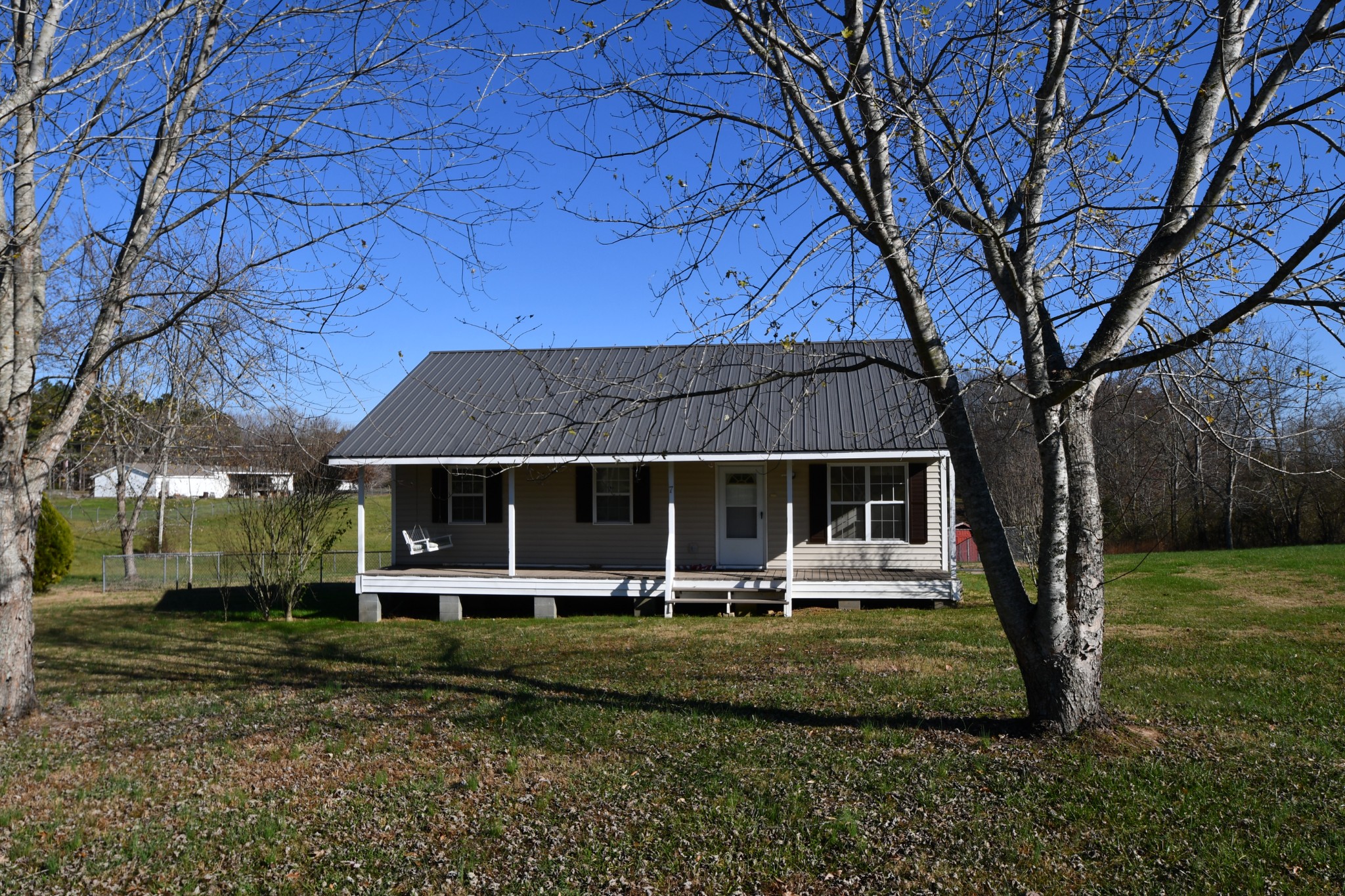 7 Fleeman Road Lawrenceburg, TN 38464 - Photo 3 of 16 front view of a house with a yard