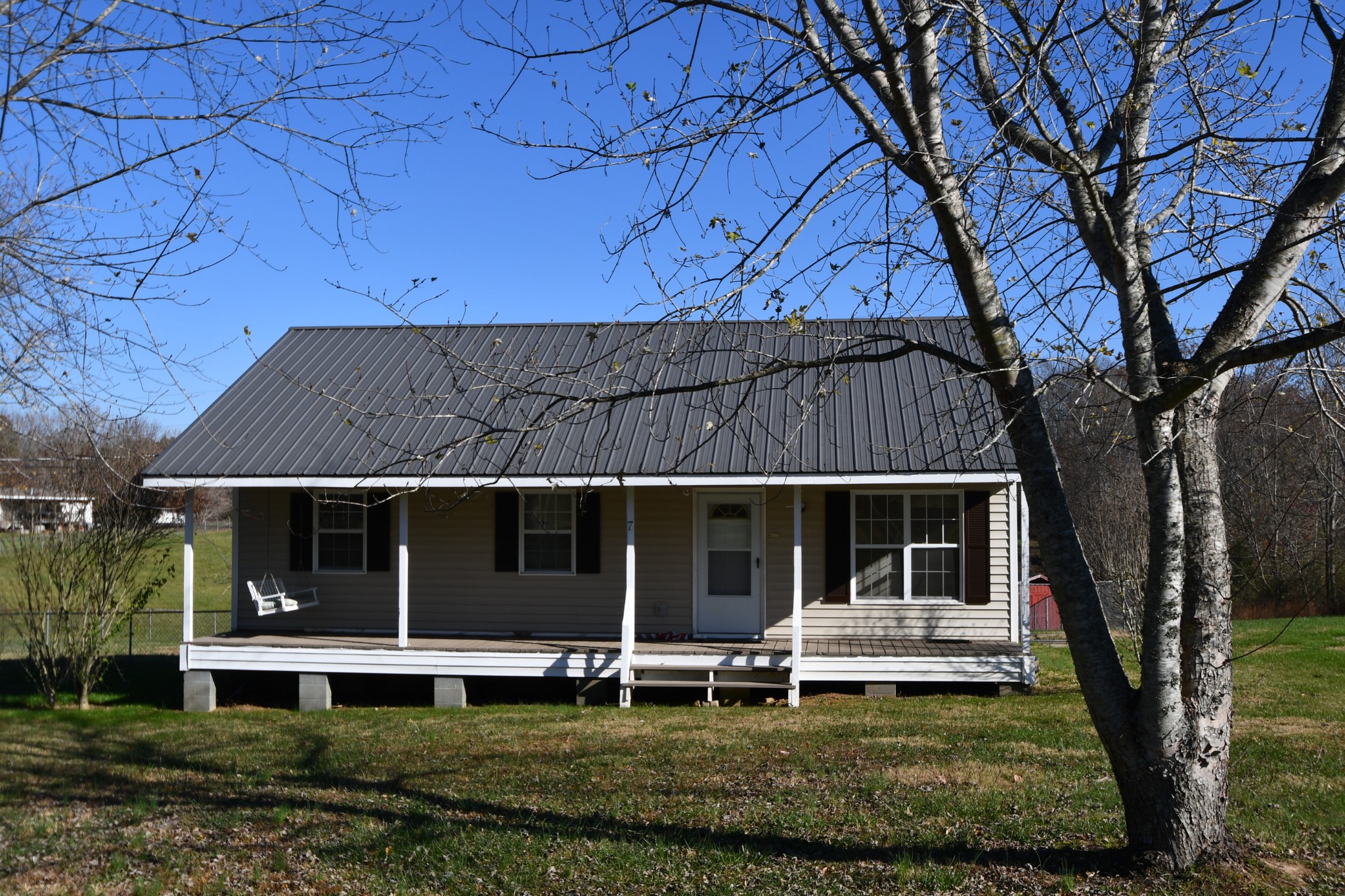 7 Fleeman Road Lawrenceburg, TN 38464 - Photo 4 of 16 a view of a house with a yard and sitting area